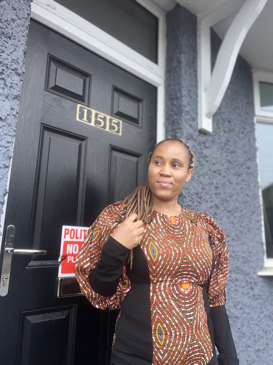 Judith Nwafor smiling outside a Nottingham home visit